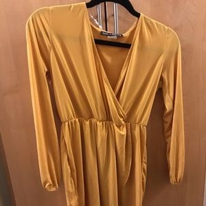 Mustard mini dress. Deep cut.